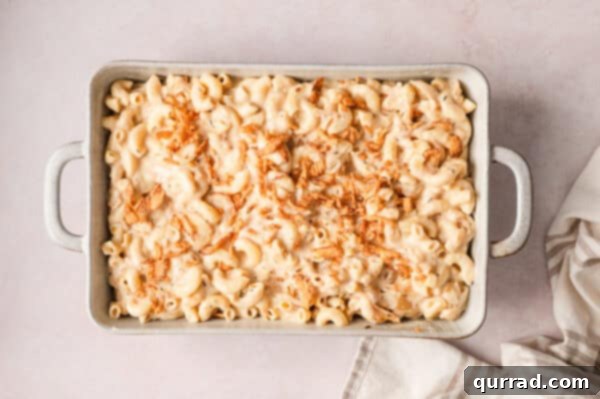 French Onion Macaroni Gratin 13 Crispy fried onions added to french onion mac and cheese sauce in a baking dish.