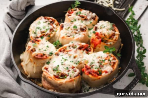 Cheesy supreme pizza rolls in a cast iron skillet