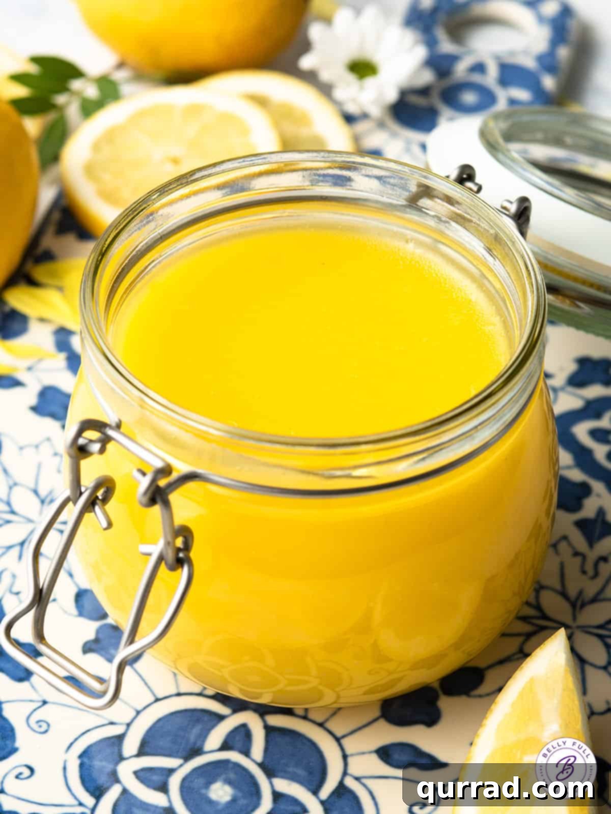 Golden Lemon Dream 2 A charming glass jar filled with vibrant, homemade lemon curd, ready to be enjoyed.