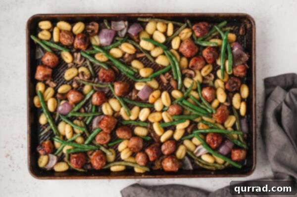 Overhead view of sheet pan gnocchi and sausage roasted to golden perfection