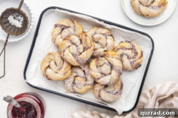 Puff Pastry Jam Spirals 9 Jam Puff Pastry Rolls piled on serving tray