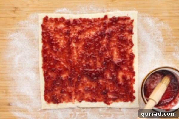 Puff Pastry Jam Spirals 3 Jam spread on a puff pastry sheet