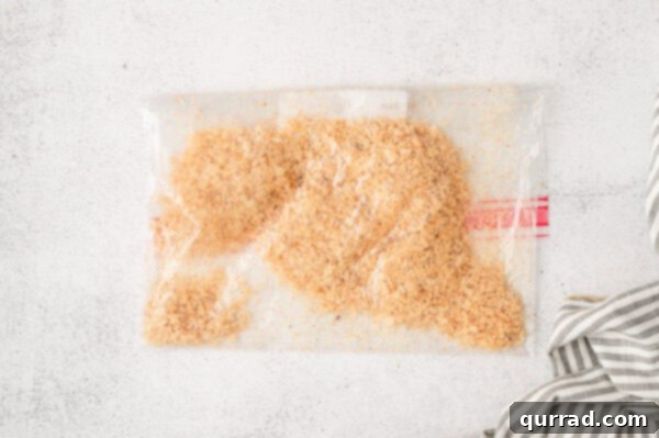 Irresistible Air-Fried Babybel Poppers 3 Crushed potato chips in a ziploc bag, ready for breading
