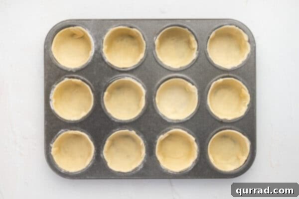 Pie crust pressed into muffin tins