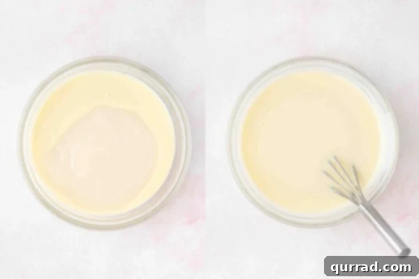 Creamy white filling, a blend of condensed milk and cream of coconut, in a mixing bowl.