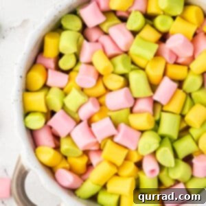A bowl filled with various pastel-colored butter mints, ready to be served.