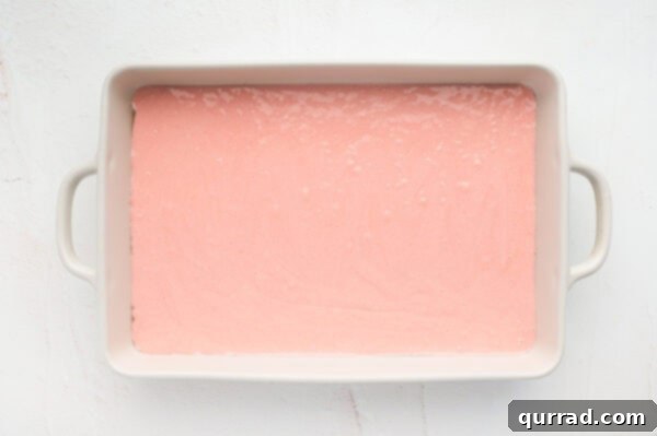 Strawberry Crunch Delight 2 Strawberry cake batter in a cake pan