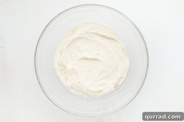 Strawberry Crunch Delight 3 A bowl of vanilla frosting
