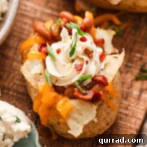 Loaded Baked Potato Delights 3 A stuffed jacket potato filled with whipped cream cheese, bacon, shredded cheddar, and scallions.