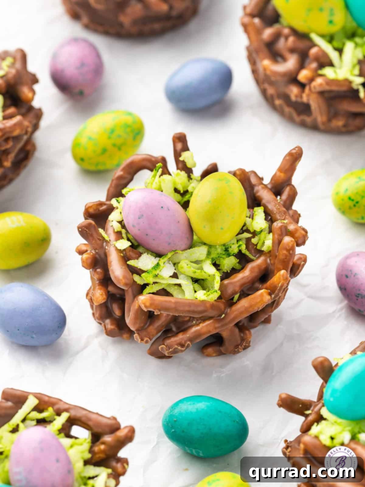Made with crunchy chow mein noodles coated in chocolate and peanut butter and pastel M&M eggs, Bird's Nest Cookies are a fun no-bake dessert. Overhead view of a bird's nest cookie