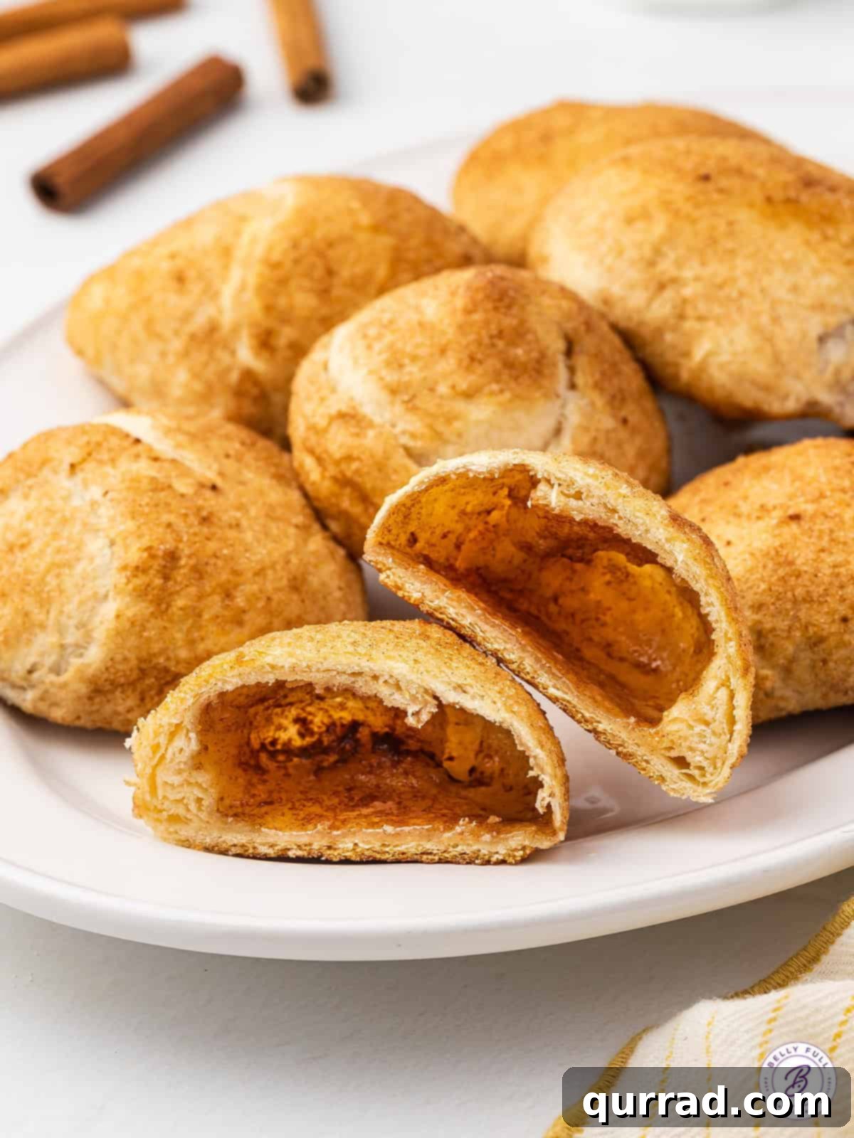 A plate of resurrection rolls, one cut in half to show the inside.