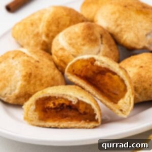 A plate of resurrection rolls, one cut in half to show the inside.