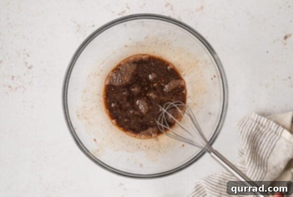 Whisking balsamic vinaigrette in a bowl