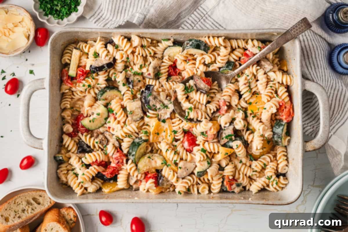 Velvety Ratatouille Pasta 8 Overhead view of a baking dish filled with creamy ratatouille pasta, perfectly combined and ready to serve.