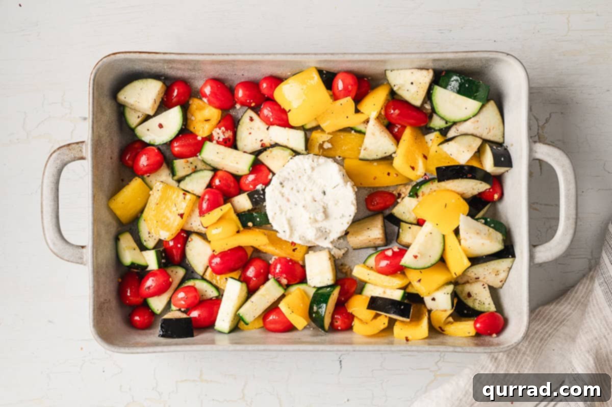Velvety Ratatouille Pasta 5 Veggies arranged on a baking sheet with a round of Boursin cheese in the center.