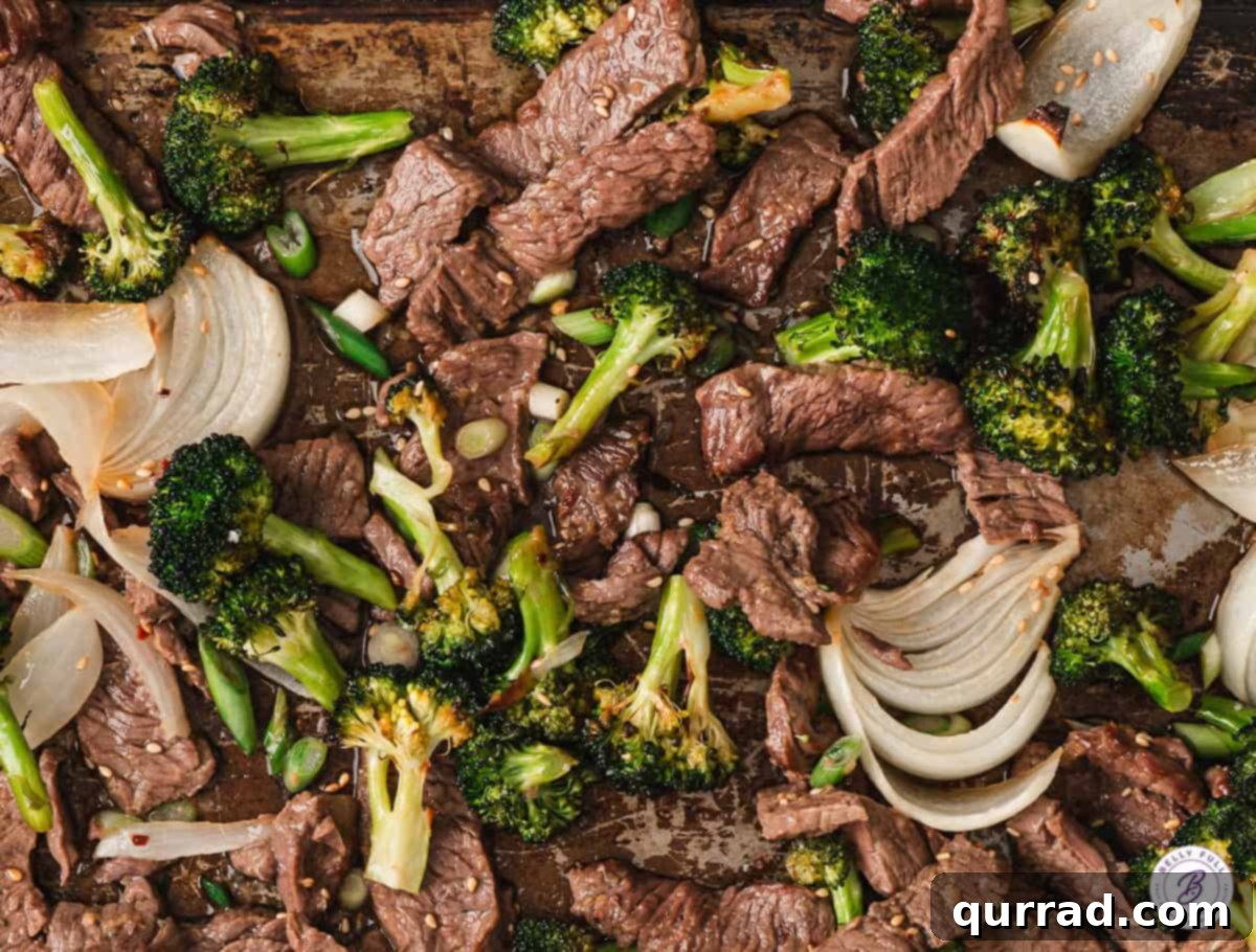 Effortless Sheet Pan Beef and Broccoli 15 Close up of sheet pan beef & broccoli, highlighting the tender beef and crisp broccoli.