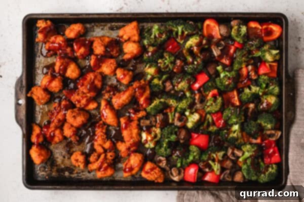 Crispy Oven Baked General Tso Chicken 4 Cooked popcorn chicken and veggies on a sheet pan
