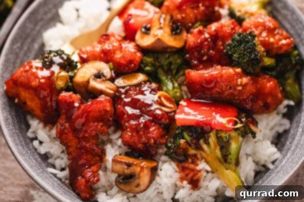 Crispy Oven Baked General Tso Chicken 6 A plate of general tso's chicken over rice