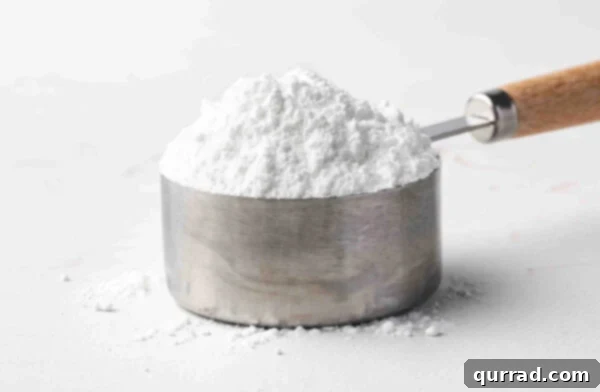 A heaping measuring cup of powdered sugar