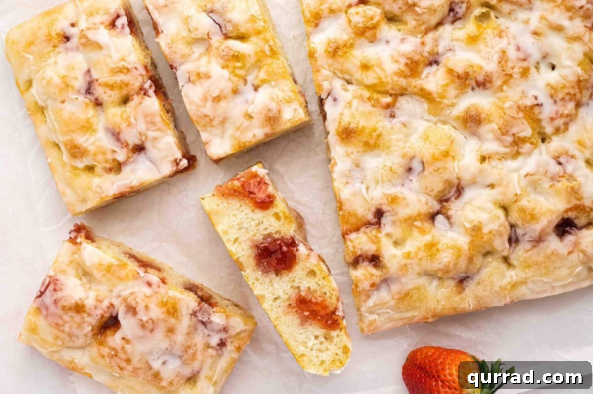 Sweet Focaccia with a Jelly Surprise 13 Overhead view of a whole Jelly Donut Focaccia, beautifully glazed and ready to be sliced