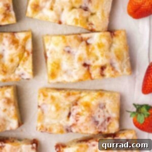 Sweet Focaccia with a Jelly Surprise 2 Overhead view of sliced jelly donut focaccia, showcasing its sweet appeal