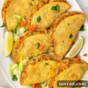A plate of freshly air-fried chicken tacos, perfectly golden and inviting