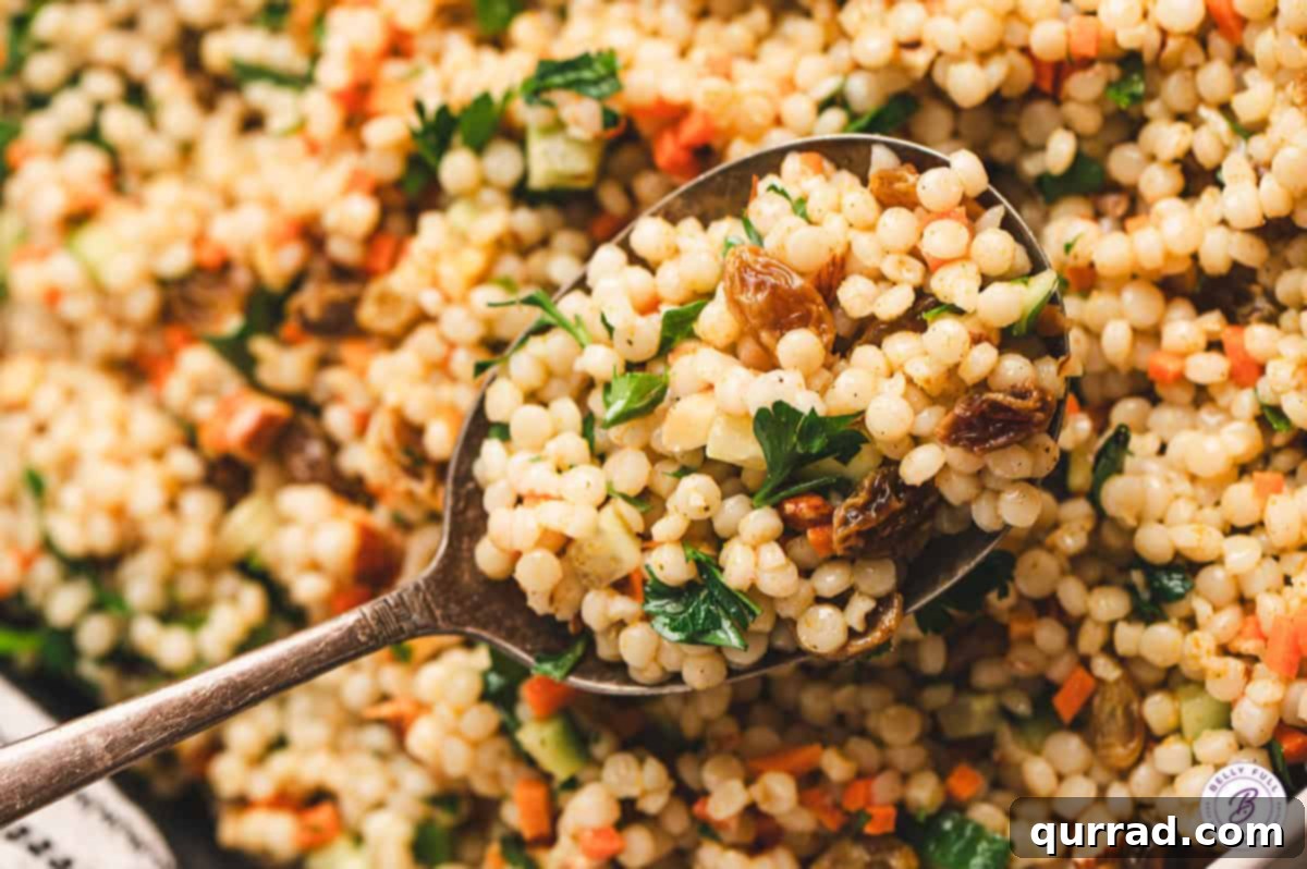 A big spoon of curried couscous salad