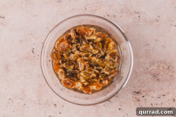 Golden raisins soaking in hot water