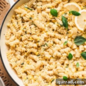 Overhead view of a pot of creamy corn pasta