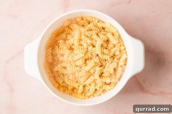 Rotini in a colander, freshly drained from the pot.