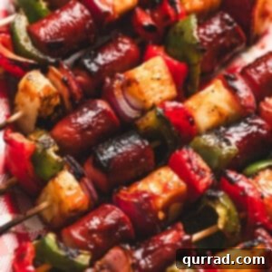Close-up of freshly grilled hot dog kabobs with a rich BBQ glaze.