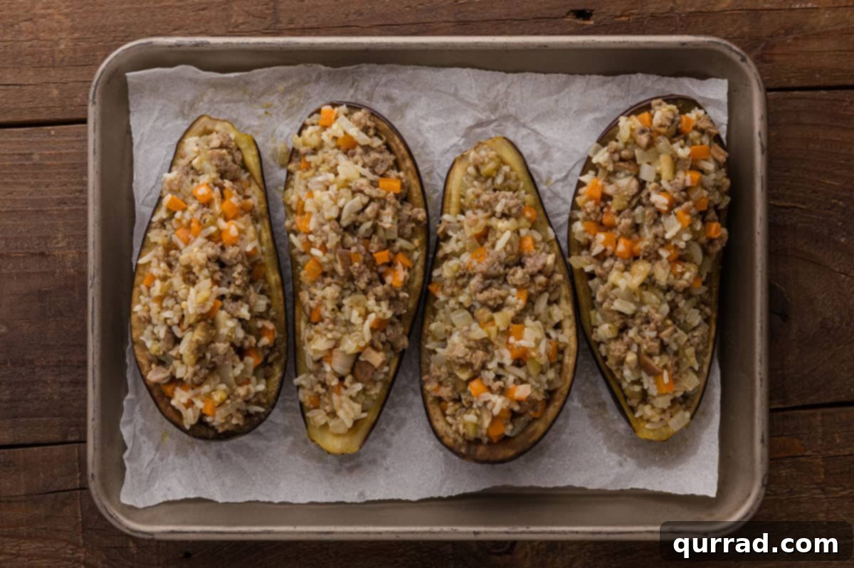 Savory Stuffed Eggplant 10 Cooked filling mixture spooned back into the hollowed eggplant shells.