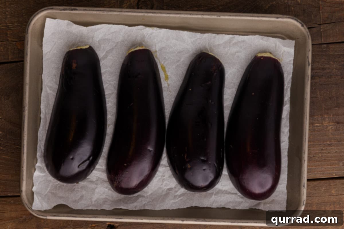 Savory Stuffed Eggplant 6 Eggplant halves roasted with golden brown edges and softened flesh.