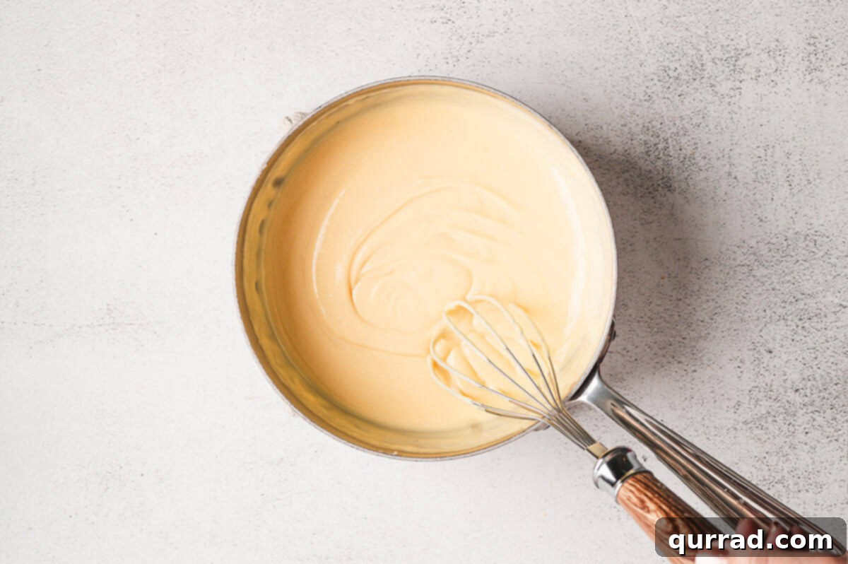 Liquid Gold Cheese 8 Smooth, golden cheese sauce ready to serve.