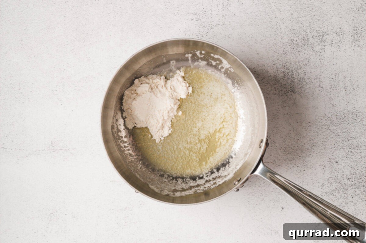 Liquid Gold Cheese 4 Butter melting in a saucepan over medium heat.