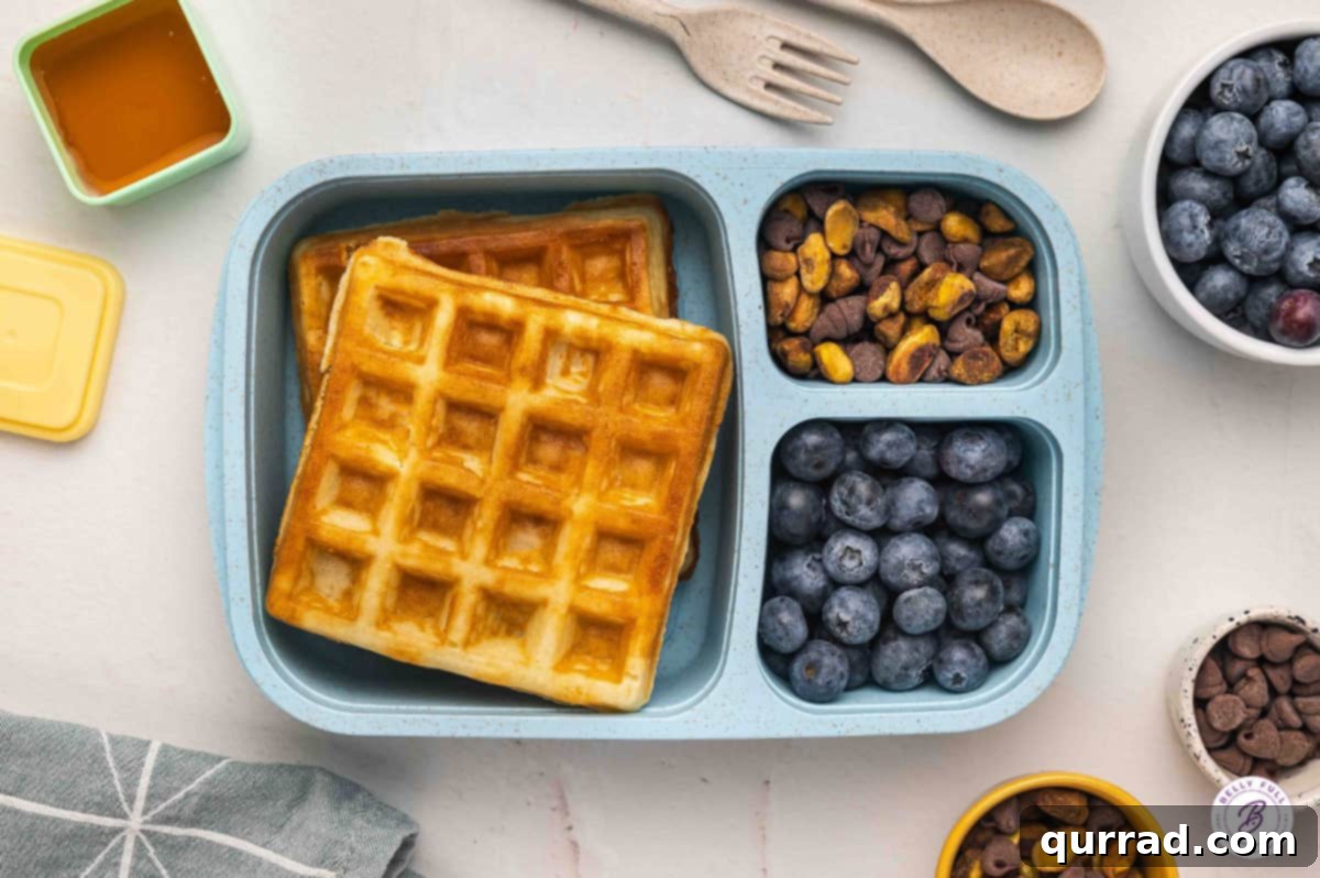 Delicious & Easy School Lunches 6 Breakfast for lunch bento box with waffles, fresh blueberries, pistachios, and chocolate chips.