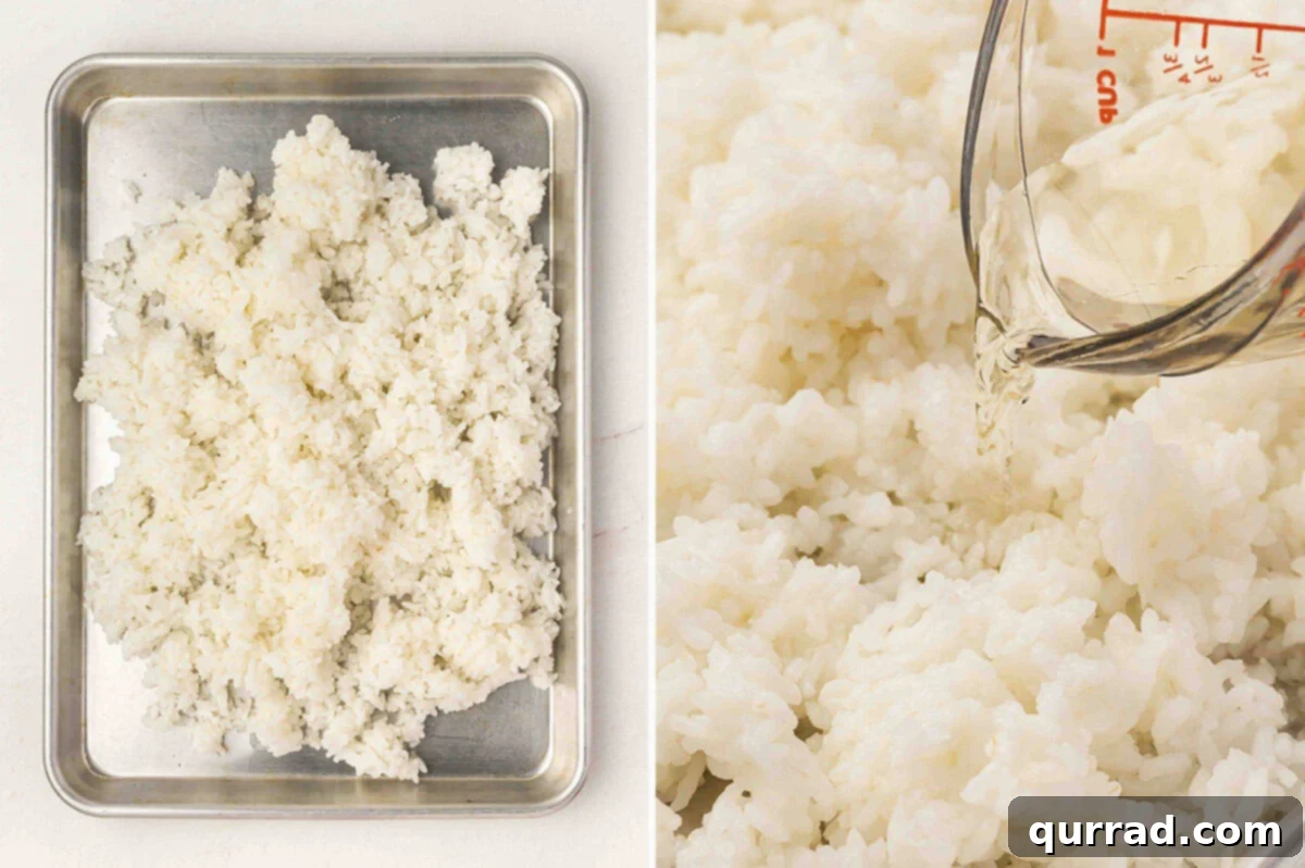 Secrets to Perfect Sushi Rice 7 Cooked sushi rice spread on a baking sheet with rice vinegar mixture being poured over the top.