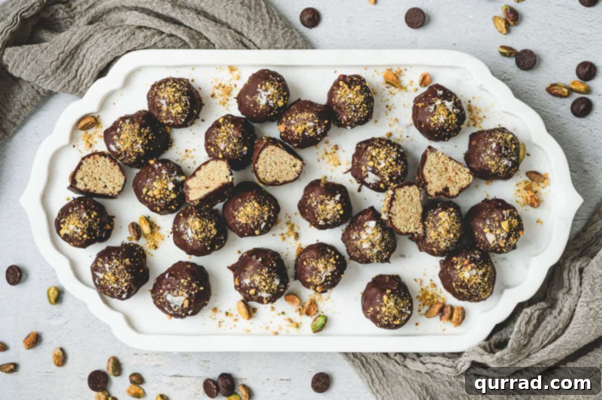 Decadent Dubai Truffles 11 Dubai chocolate truffles arranged on a white serving platter.