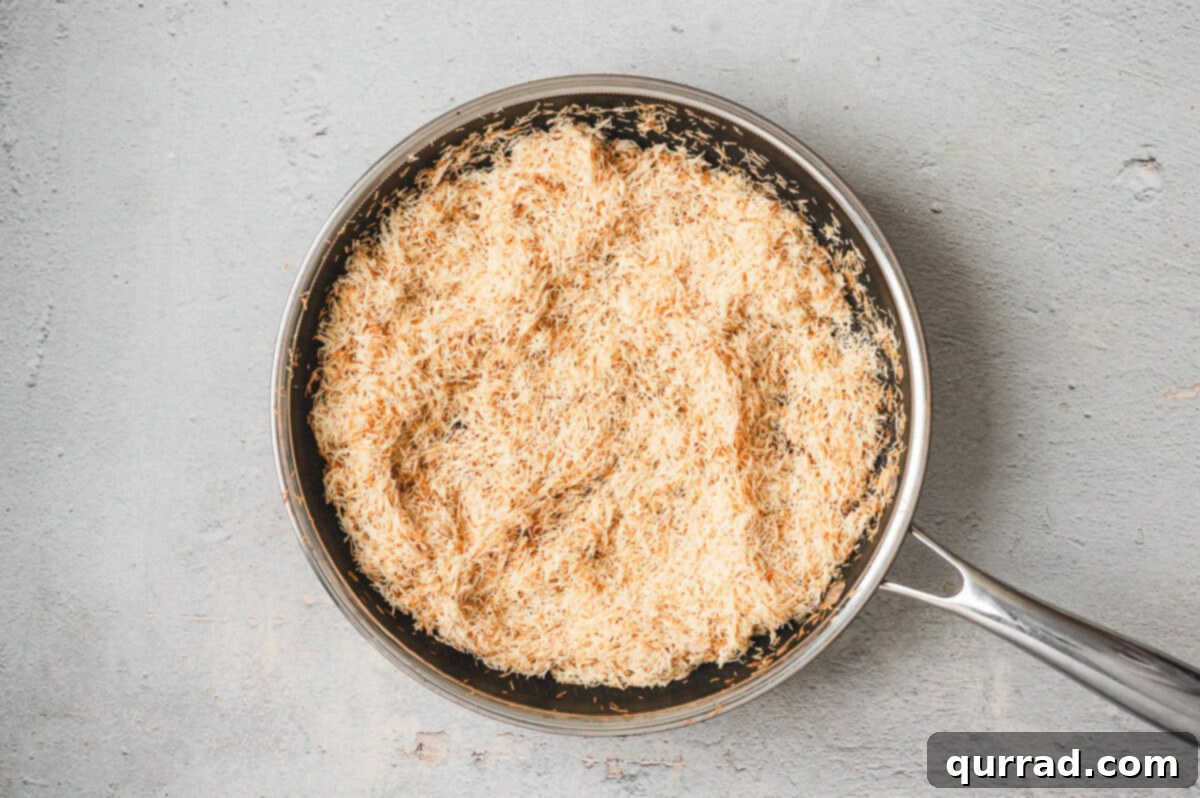 Decadent Dubai Truffles 5 Golden toasted kataifi (shredded phyllo dough) in a stainless steel skillet.