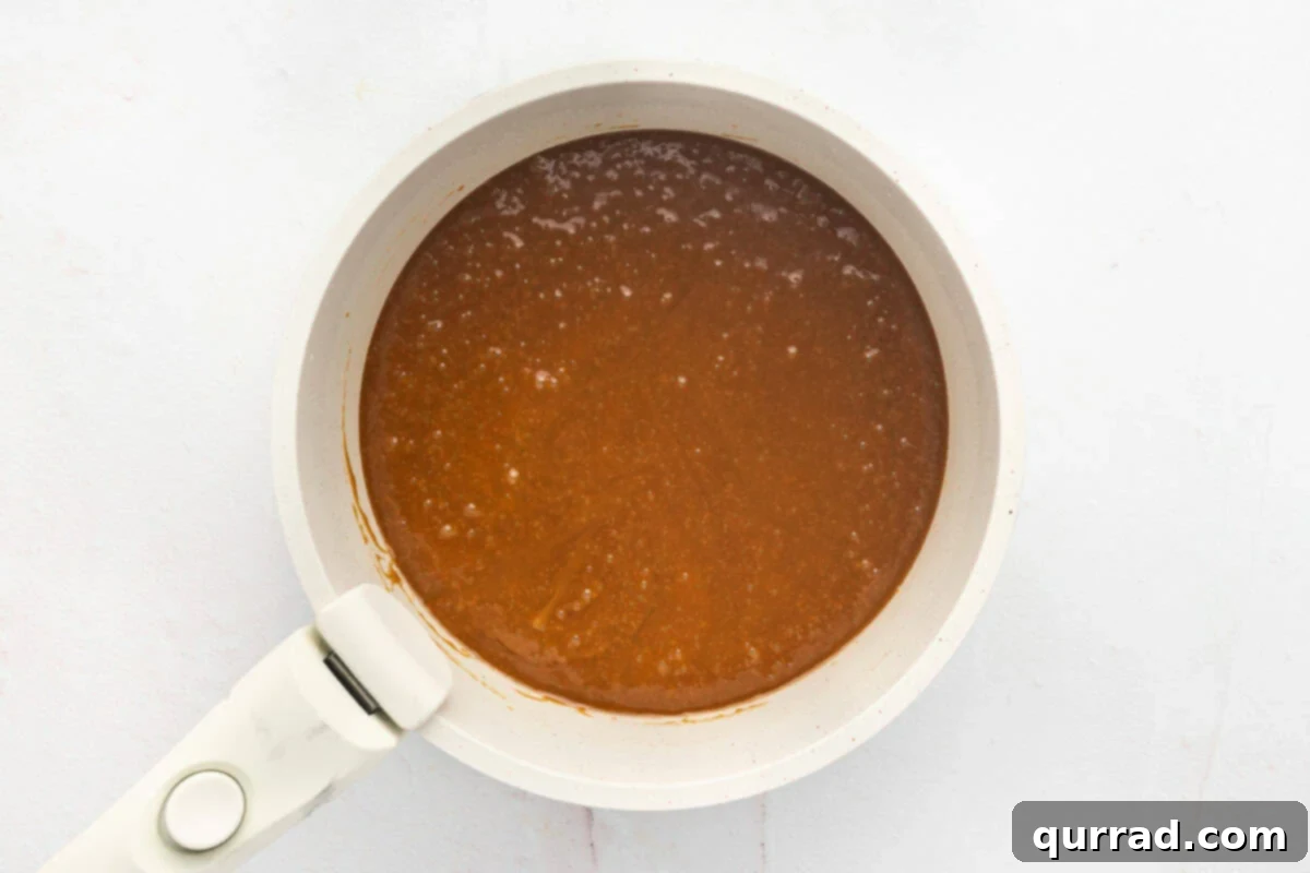 Combine butter, sugar, vanilla, and salt in a saucepan. Toffee mixture cooking in a saucepan