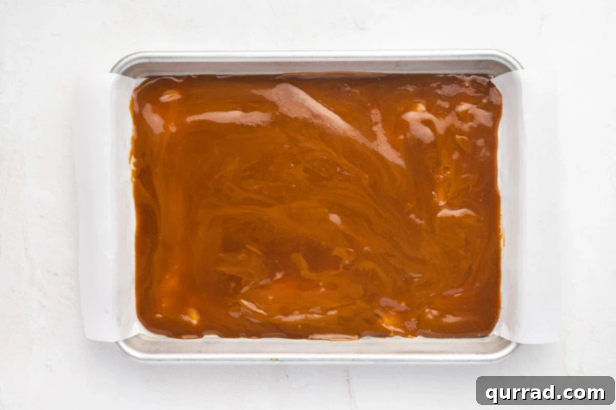 Pour the toffee mixture onto the prepared baking sheet. Toffee spread evenly on a baking sheet