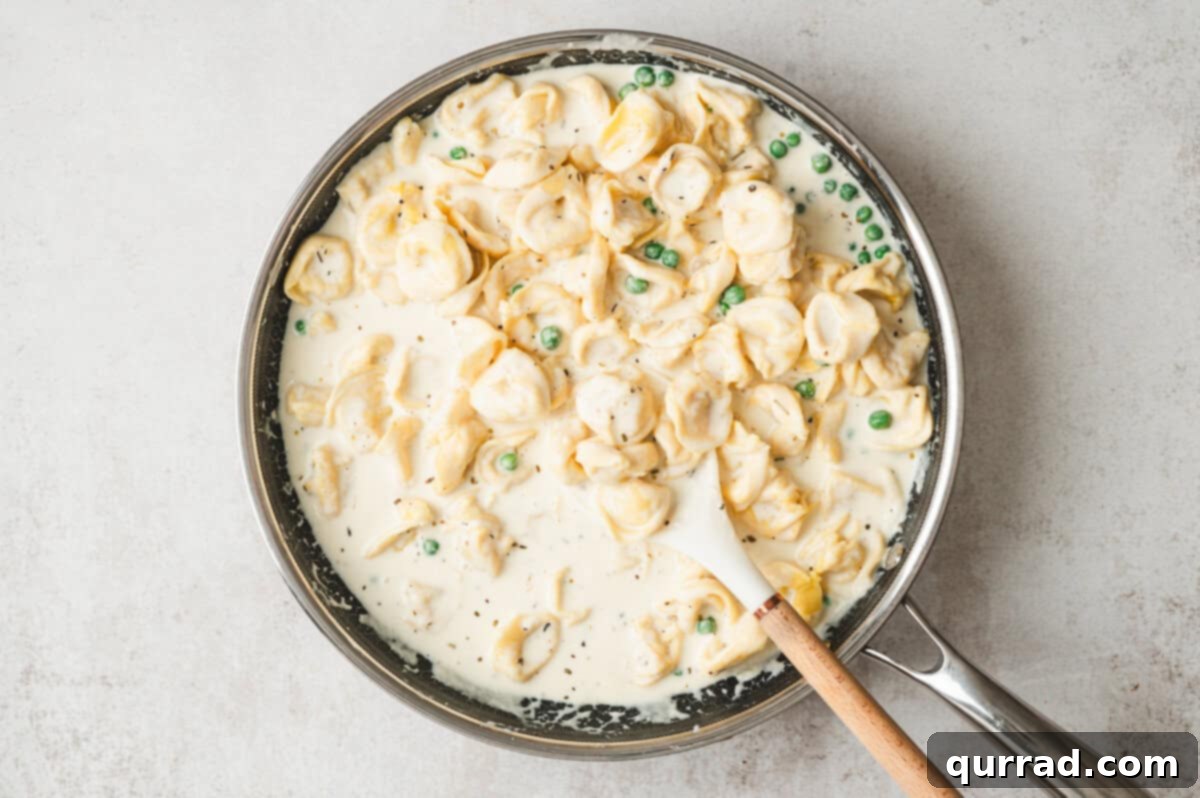 Tortellini in Cream Sauce
Tortellini Alfredo Magic 8 Cheese tortellini and peas tossed into creamy alfredo sauce in a large skillet with peas.