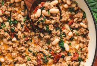 Tuscan Sausage and White Bean Skillet