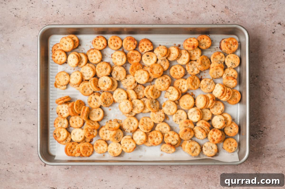 Garlic Bread Bites 8 Golden garlic seasoned Ritz Bits on a sheet pan after baking