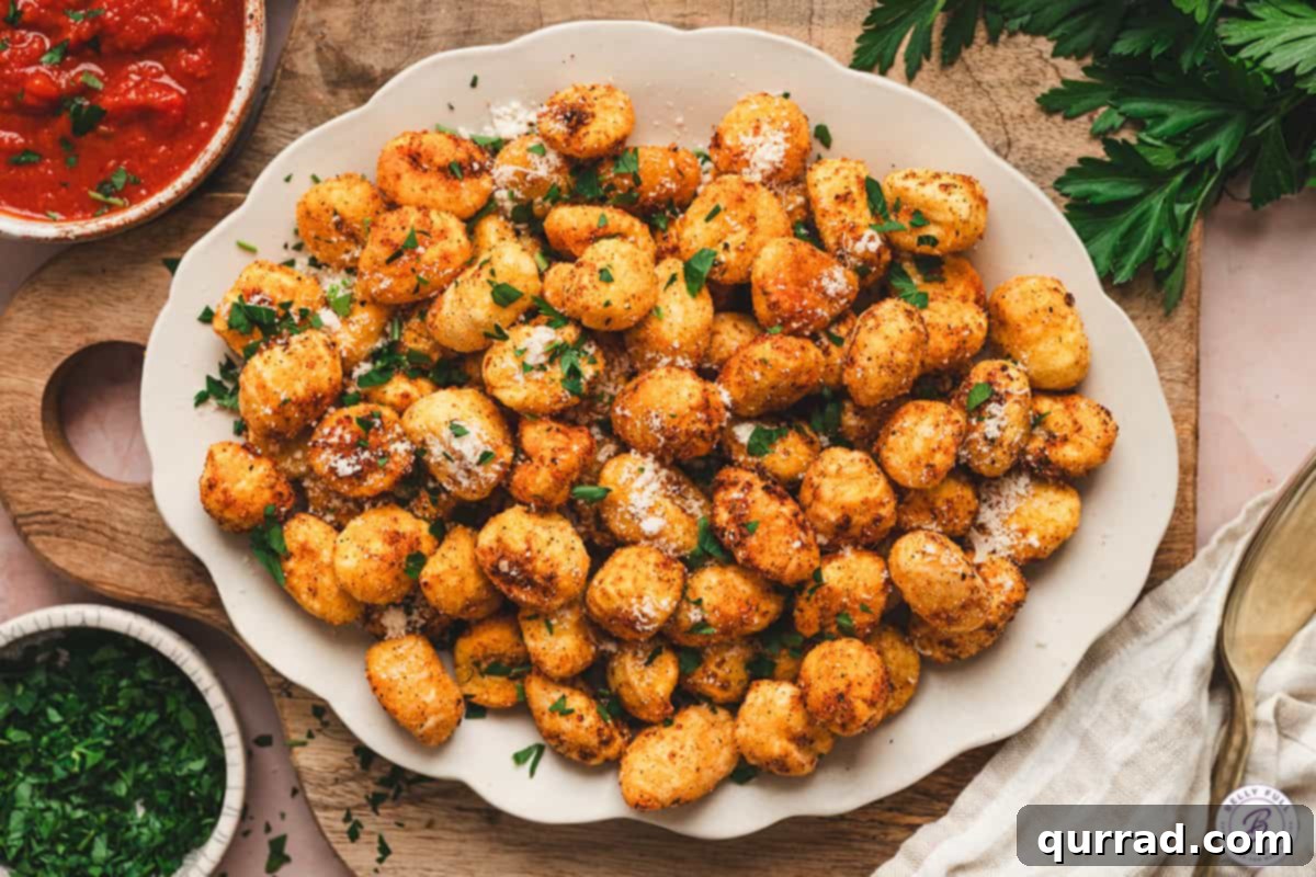 Air Fryer Gnocchi
Air-Fried Gnocchi Bites 8 Air fryer gnocchi arranged on a platter with Parmesan and parsley, served with a bowl of marinara sauce on the side.