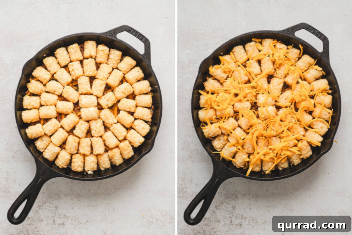Tater tots arranged over the beef mixture and then topped with shredded cheddar cheese.