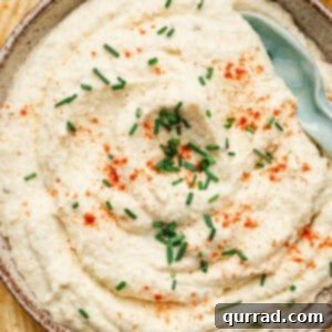 Deviled Egg Inspired Dip 3 Close-up of deviled egg dip with garnishes.