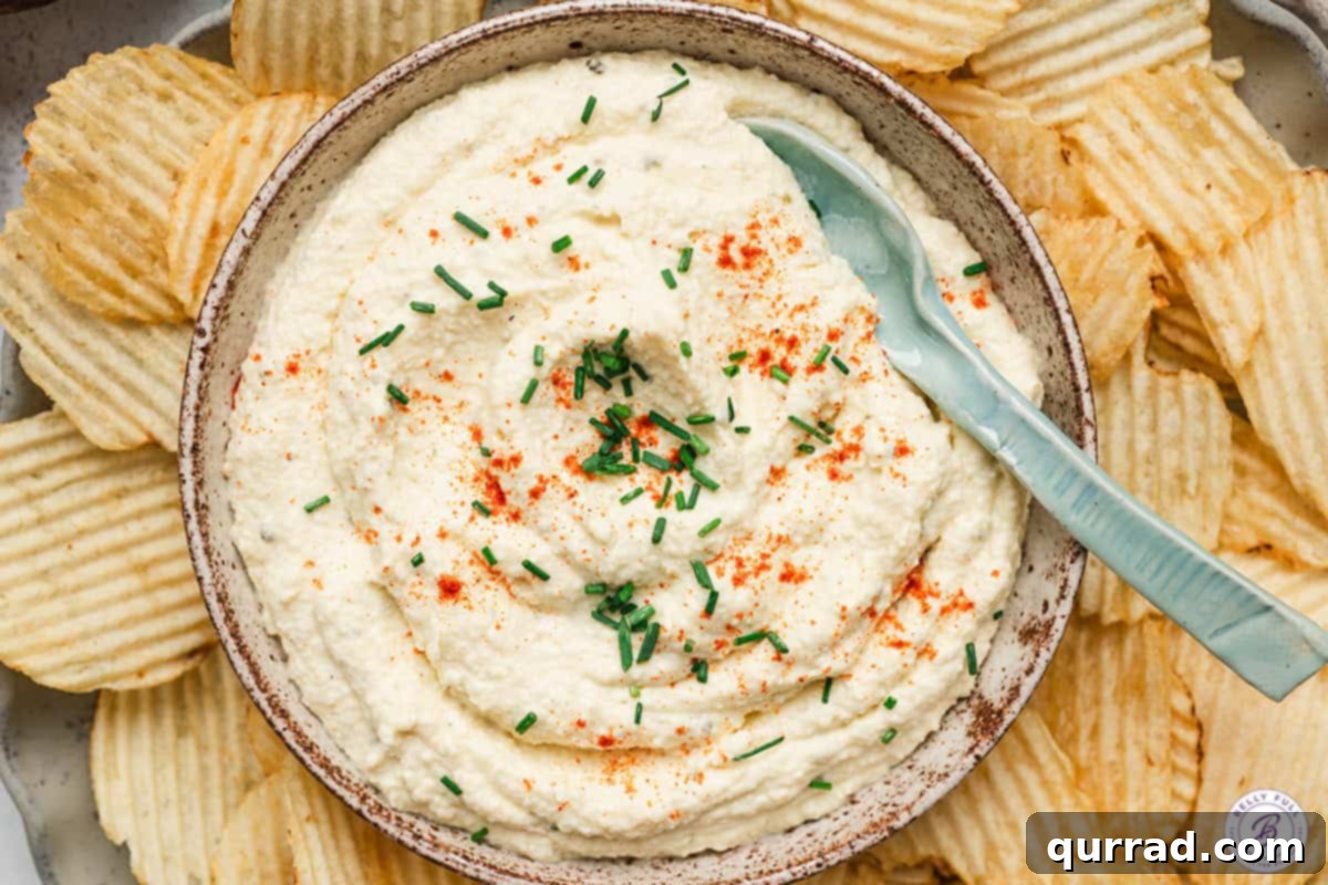 Deviled Egg Inspired Dip 7 Overhead view of deviled egg dip with chips.