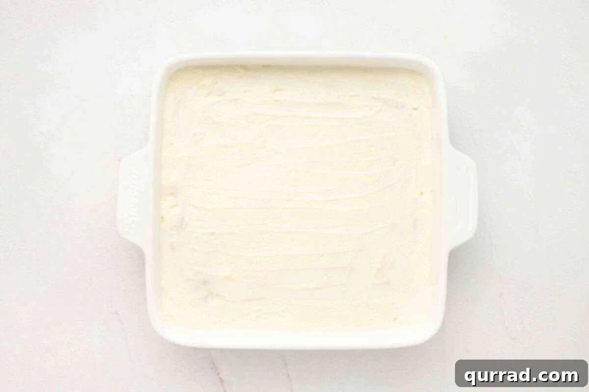 Smoothly spread cream over the final layer of Oreos.