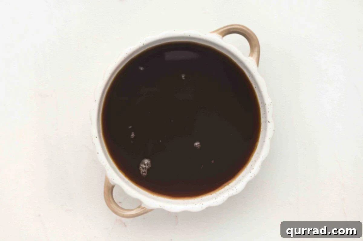 Coffee and Kahlúa mixture in a white bowl.
